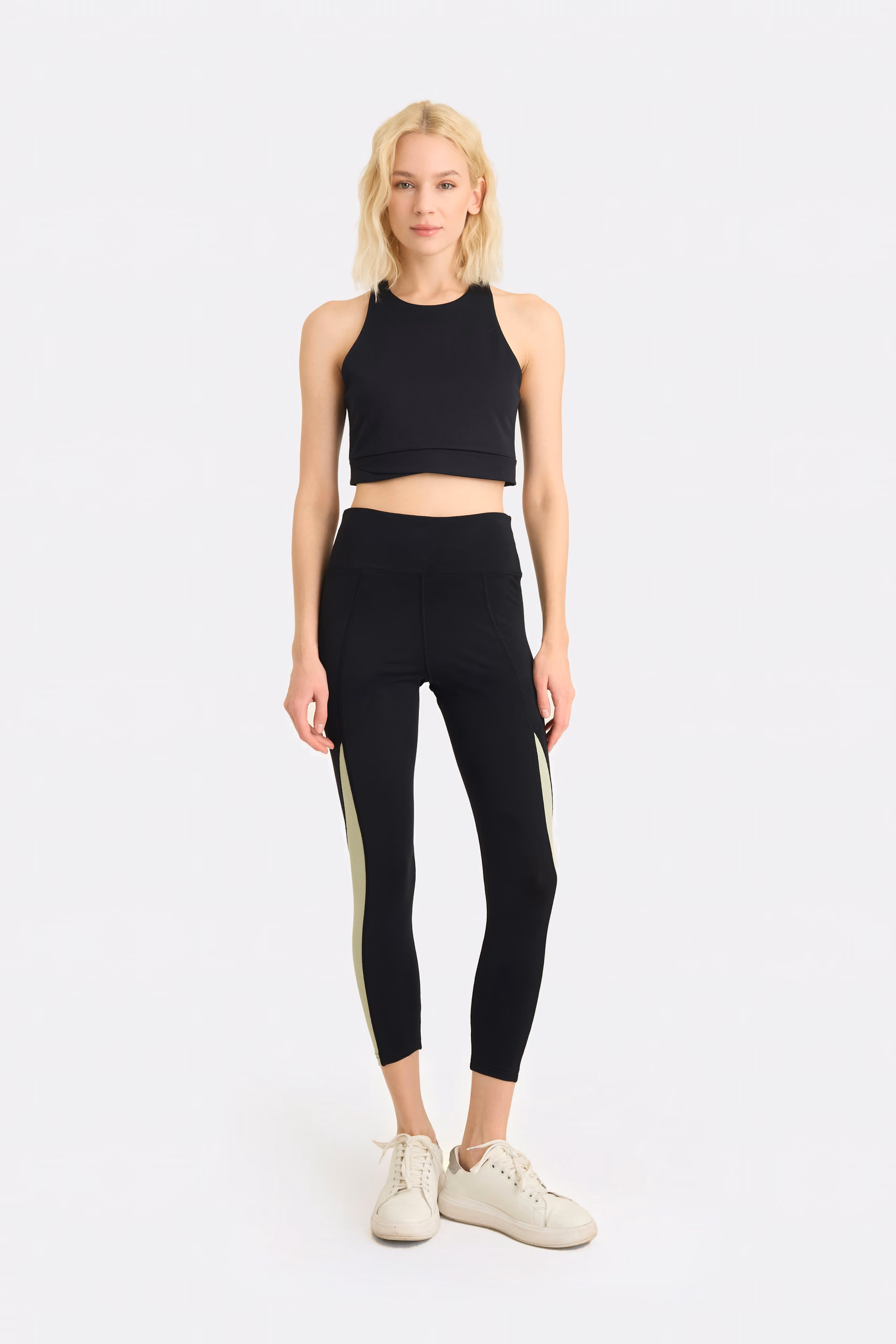 Leggings neri con pannelli verde salvia
