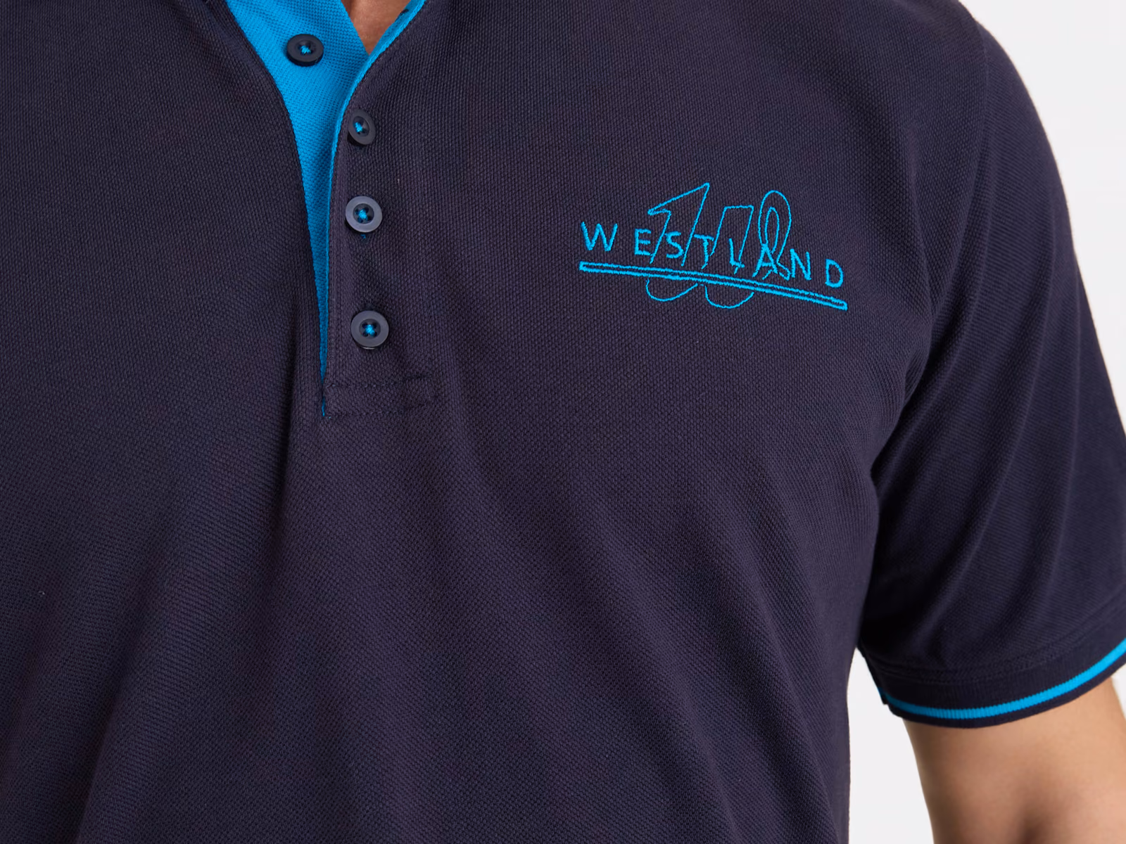 Polo blu navy in piqué con collo profilato, cannoncino interno a contrasto e logo sul petto